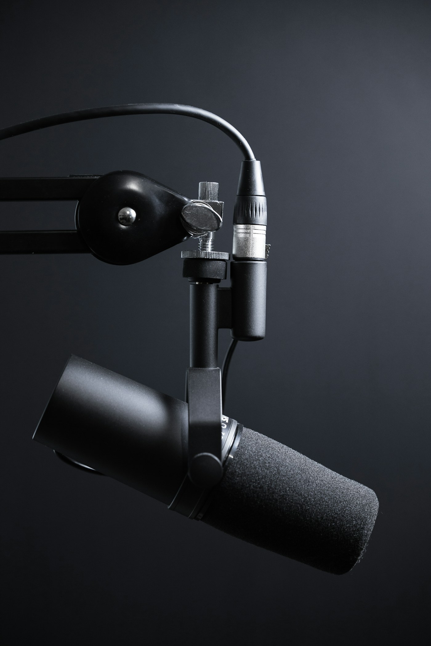 A studio microphone ready to record the Mind Out Trivia podcast